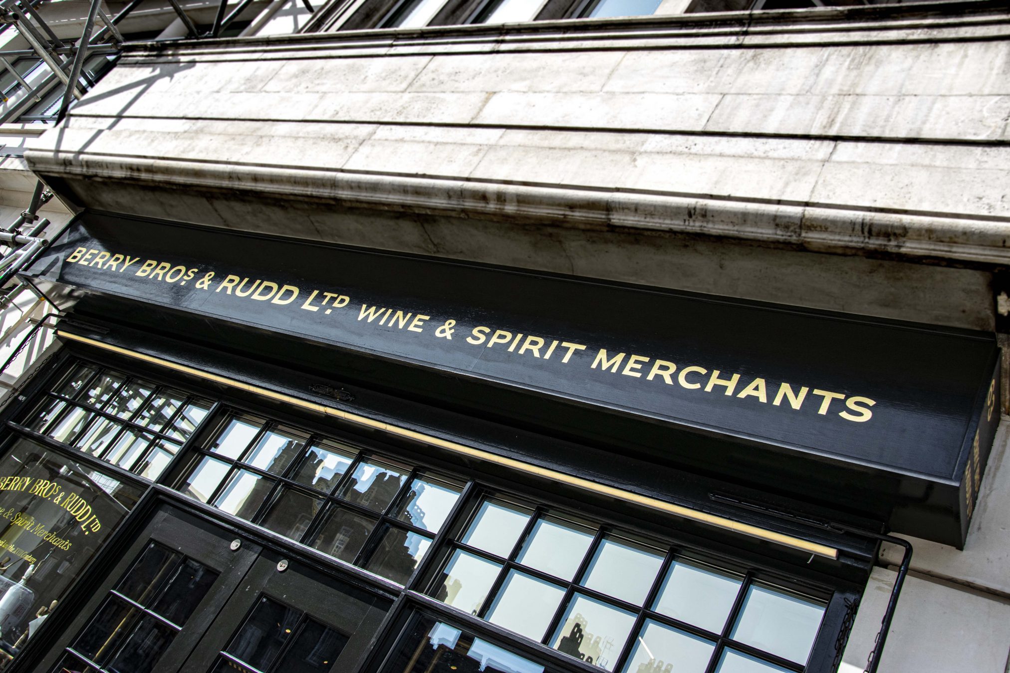 Case History Berry Bros Rudd. NGS Painted Traditional sign writers, of London NGS St James's Berry Bros & Rudd sign gilding. signwriting book sign painting book urban distressed NGS London ghost sign lettering gold leaf on glass architectural signs. Caslon NGS Font Berry Bros.