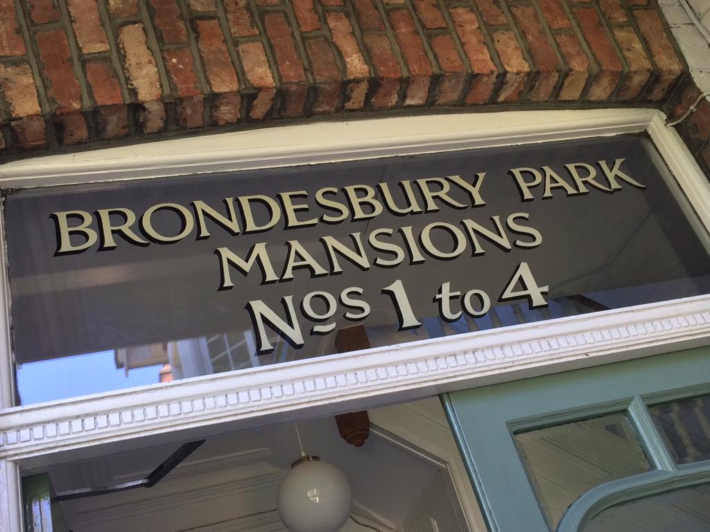Traditional sign writing.London, , London's roman white gold letters on fanlight glass 002, Magical House Numbers Sign writer NGS London