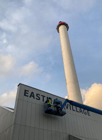 Eastman Village high level MEWP signage installs